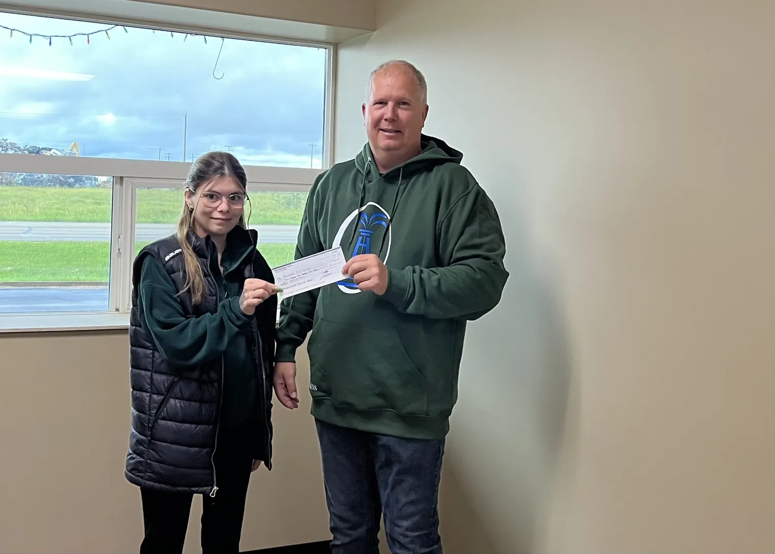 Jose Teixeira presenting the cheque to representatives of the Dr. Brosseau School French Immersion Program.